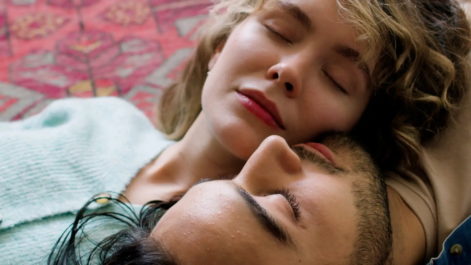 A couple resting, eyes closed