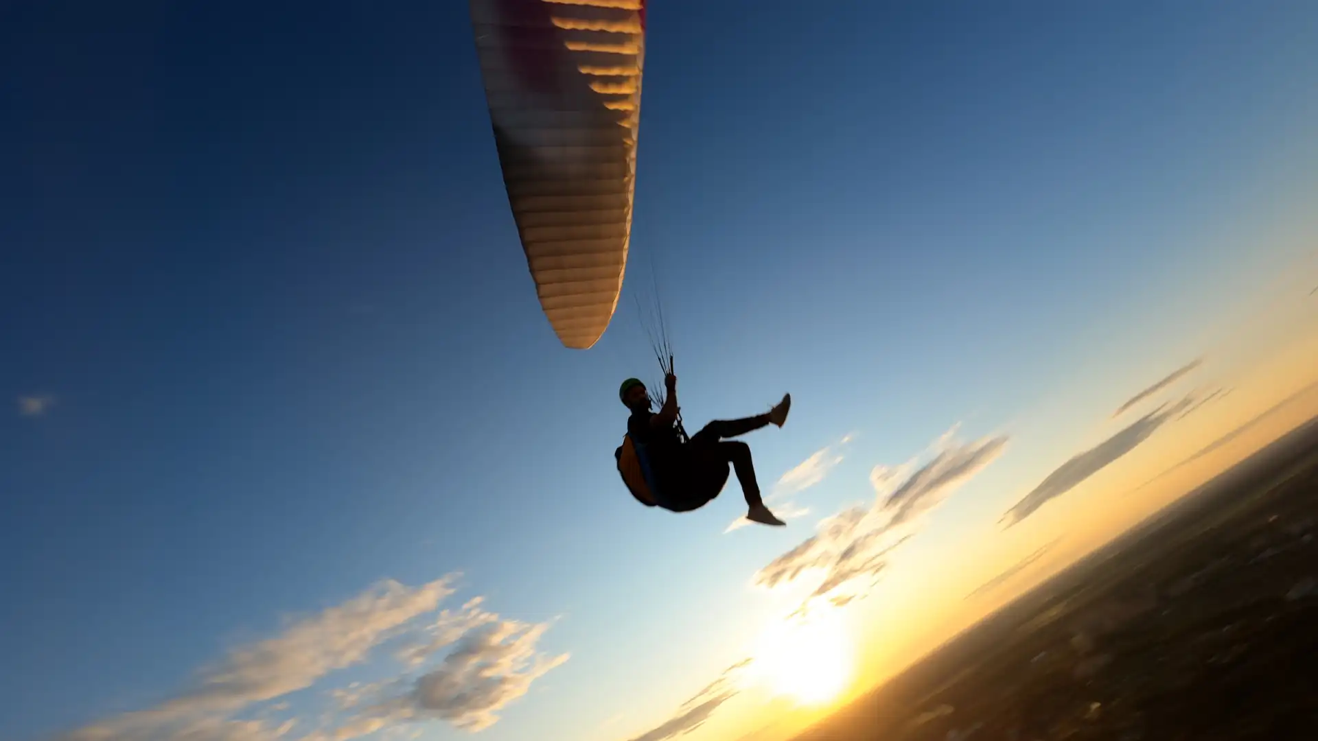 Paragliding into the sunset