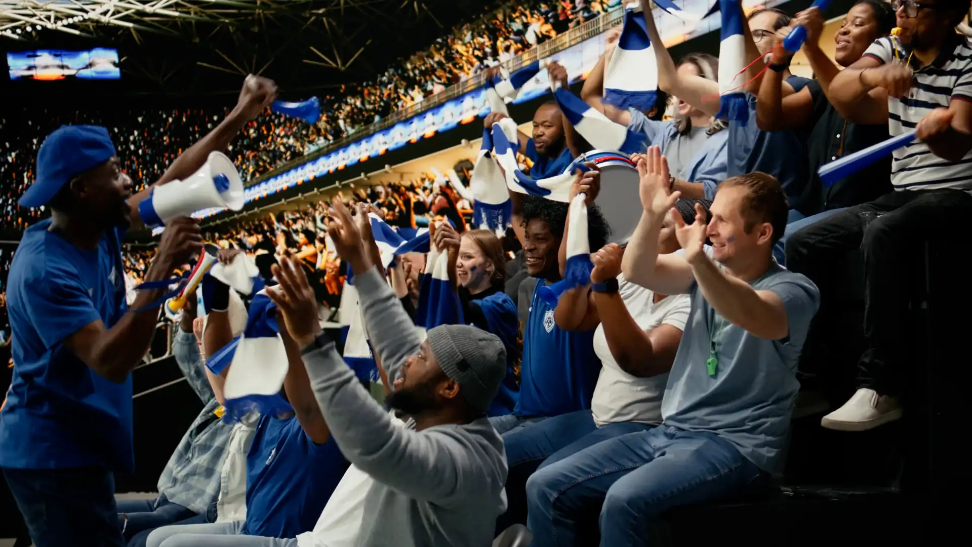Fans celebrating in a stadium